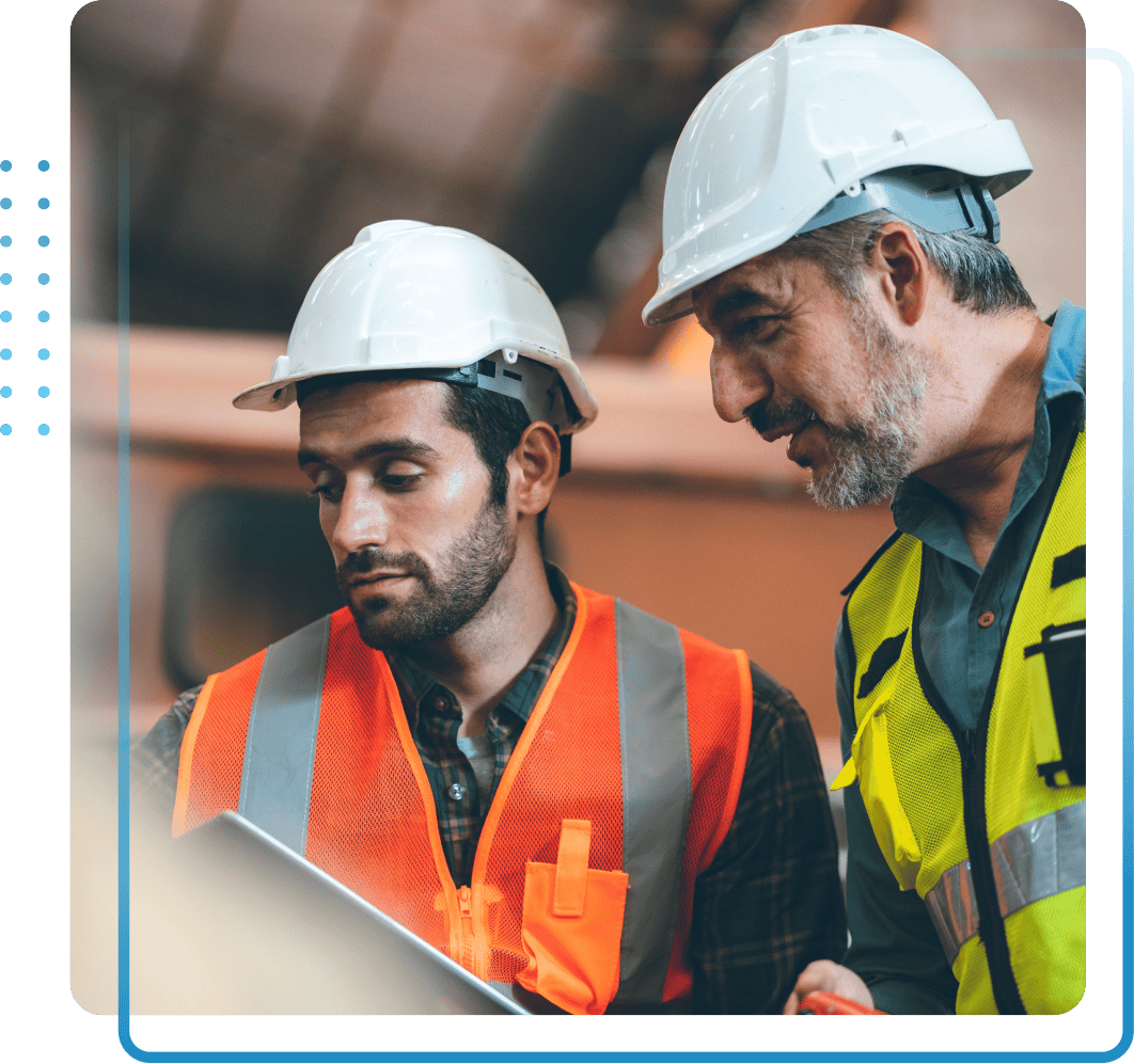 Middle aged man presenting in a meeting to his colleagues.